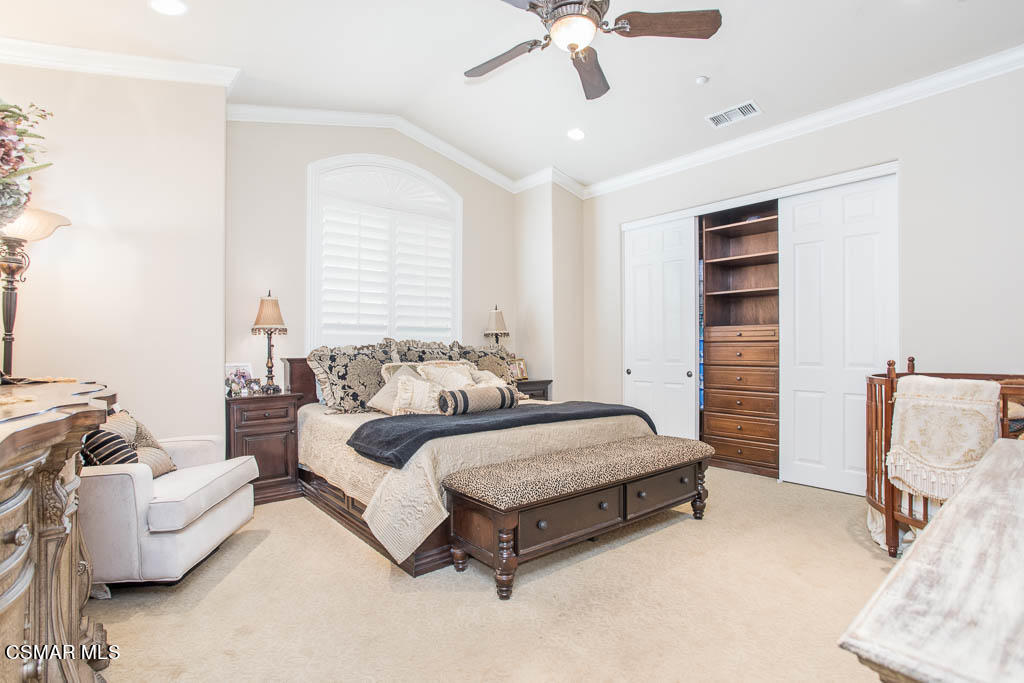 12406 Nelson Road Moorpark, CA 93021 - Photo 39 of 74 a spacious bedroom with a bed and furniture