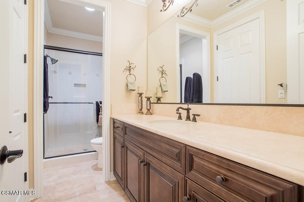 12406 Nelson Road Moorpark, CA 93021 - Photo 40 of 74 a bathroom with a double vanity sink mirror and double