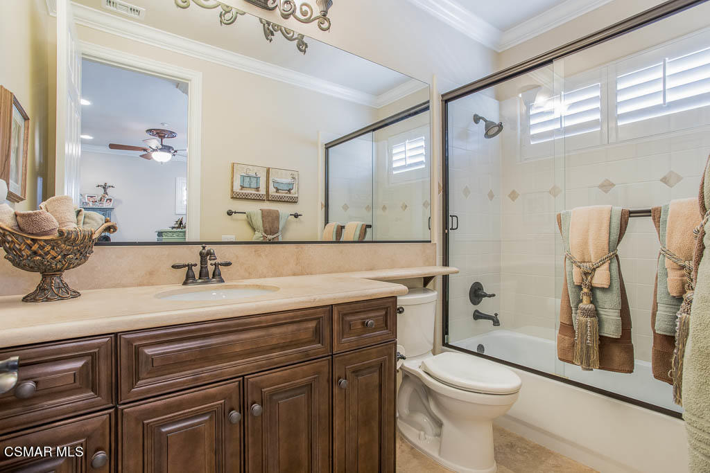 12406 Nelson Road Moorpark, CA 93021 - Photo 41 of 74 a bathroom with a granite countertop sink mirror vanity and toilet