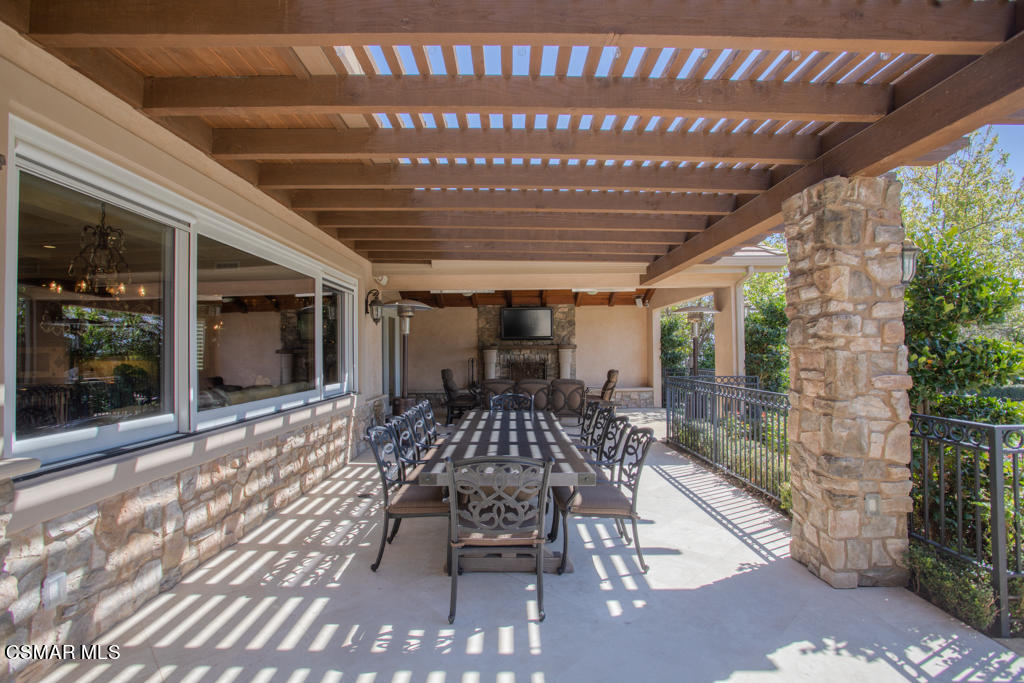 12406 Nelson Road Moorpark, CA 93021 - Photo 47 of 74 a view of a patio with table and chairs and potted plants