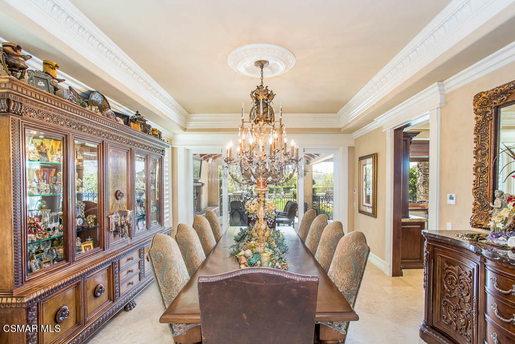 12406 Nelson Road Moorpark, CA 93021 - Photo 10 of 74 a view of a dining room with furniture a chandelier and large windows