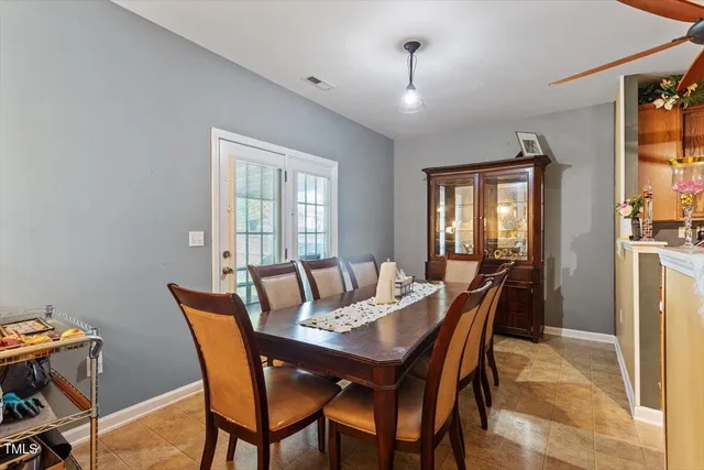 a view of a dining room with furniture and window