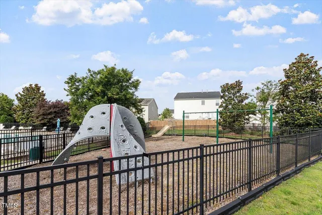 a view of multiple house with a yard