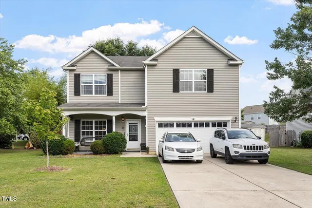 a view of a car parked in front of a house