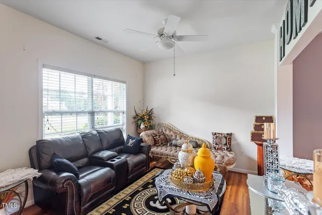 a living room with furniture and a window