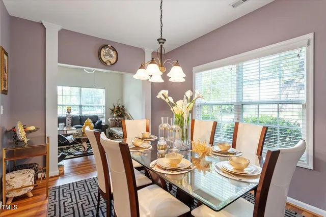 a view of a dining room with furniture window and outside view