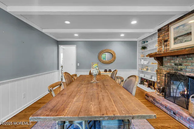 a living room with a table and a fireplace