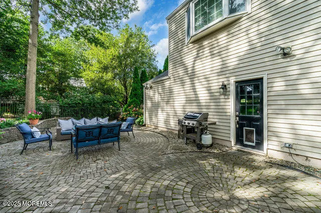a view of a two chairs in the back yard