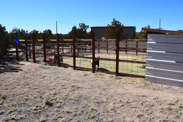 a view of a terrace with wooden fence