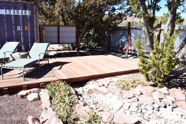 a view of a backyard of the house