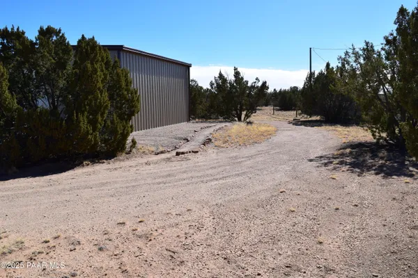 a view of a backyard of the house