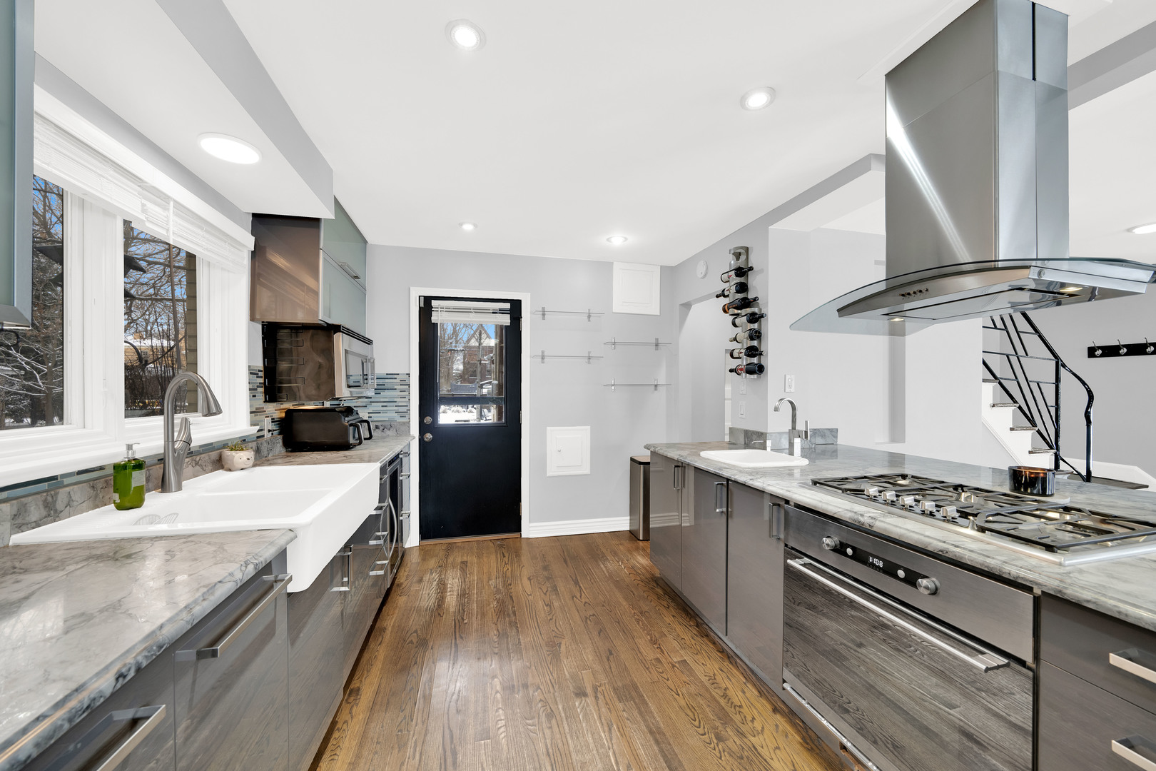 478 Kent Road Riverside, IL 60546 - Photo 10 of 41 a large kitchen with stainless steel appliances granite countertop a lot of counter space and wooden floors