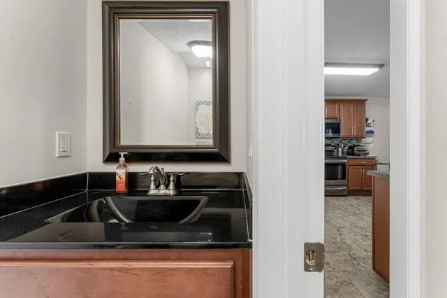 a bedroom with furniture and a flat screen tv