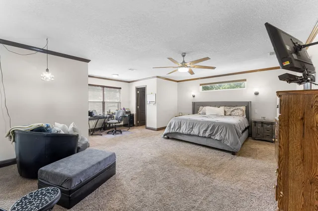 a spacious bathroom with a tub shower and a mirror