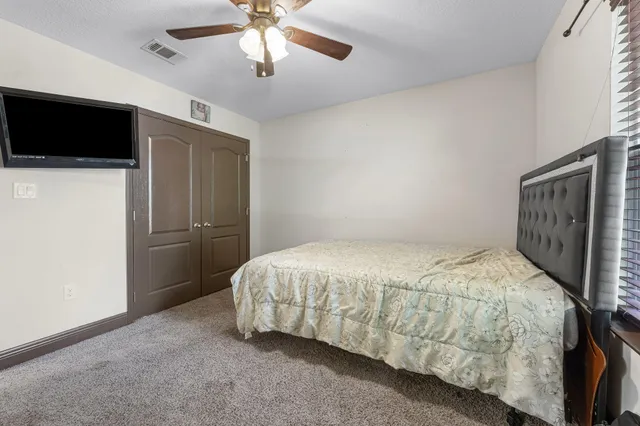 a bathroom with a toilet and shower