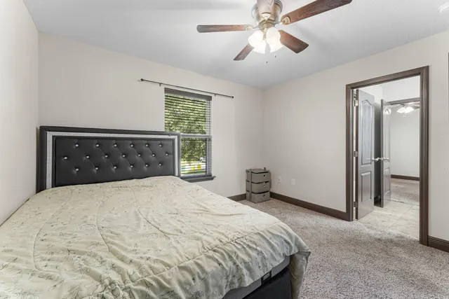 a view of a patio with a table chairs and a backyard