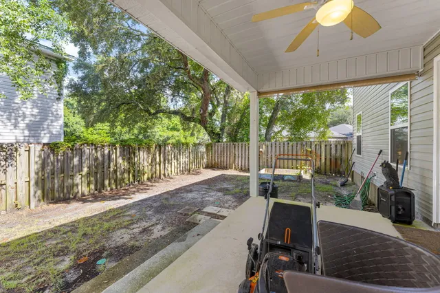 a view of a house with backyard porch and sitting area