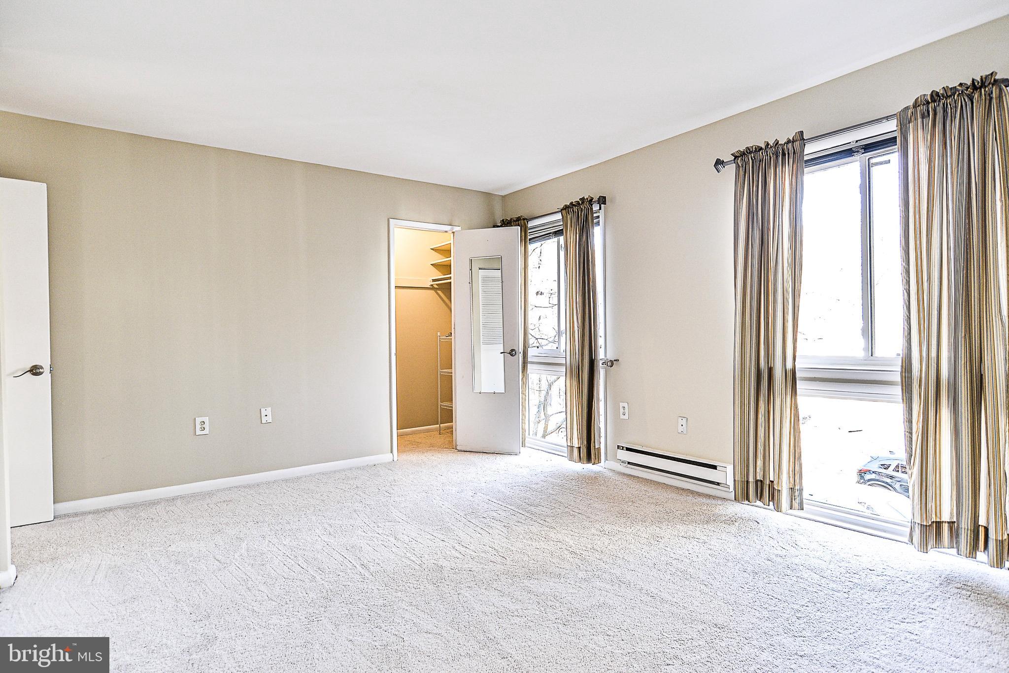 2430 Cloudcroft Square Reston, VA 20191 - Photo 11 of 27 Large master bedroom with floor to ceiling windows