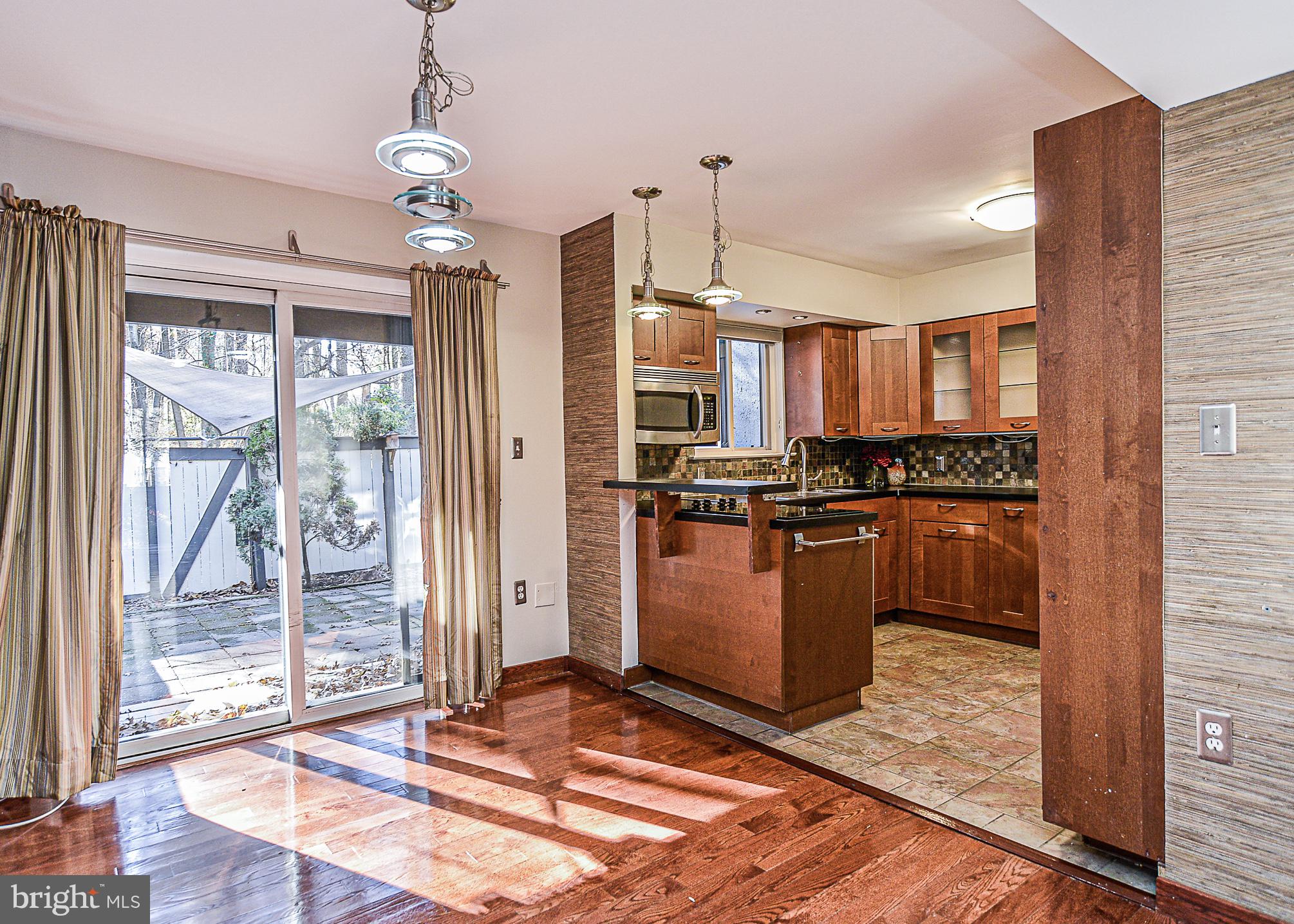 2430 Cloudcroft Square Reston, VA 20191 - Photo 6 of 27 Lots of light shines through from the patio!