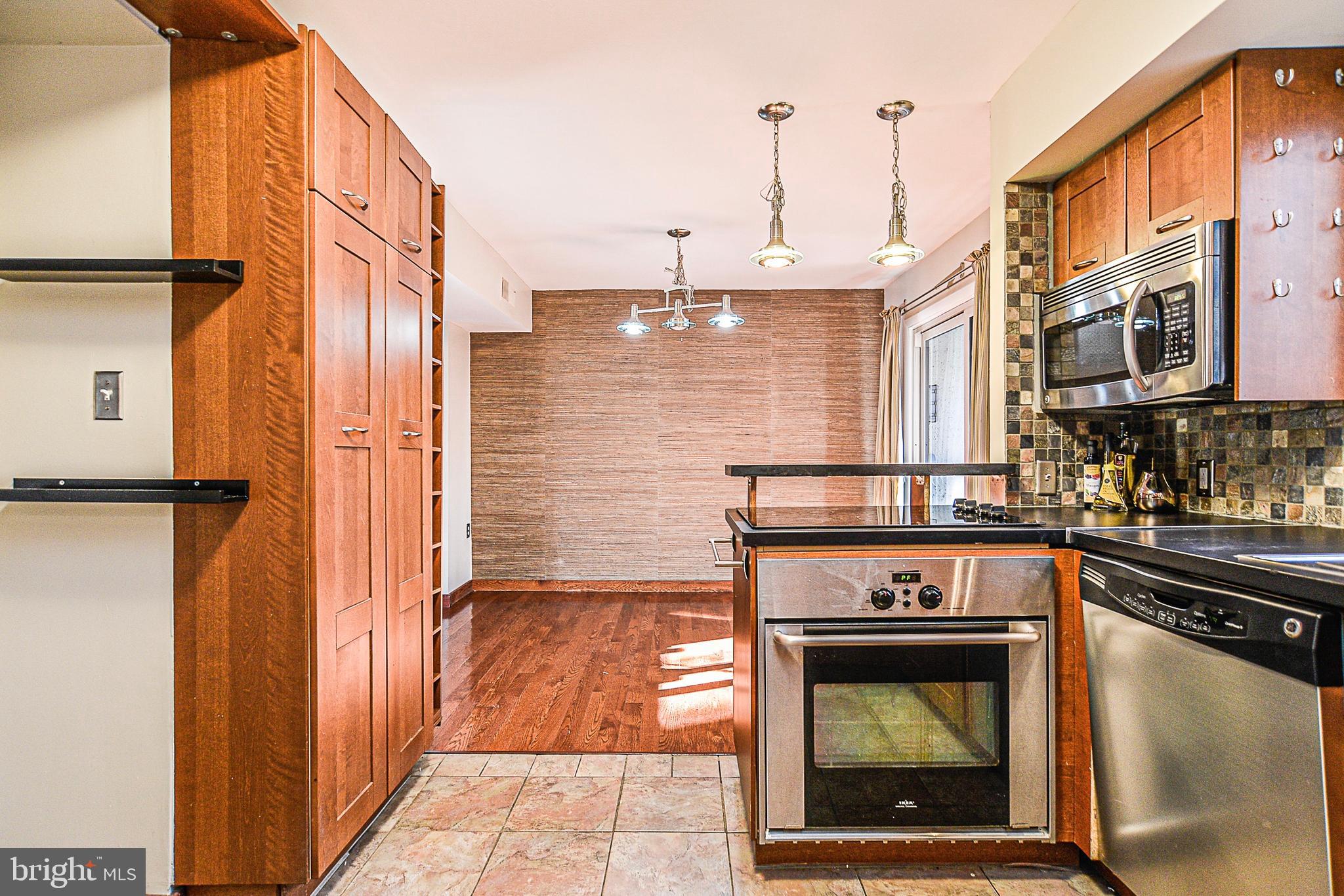 2430 Cloudcroft Square Reston, VA 20191 - Photo 8 of 27 Extra shelving for optimal space in the kitchen