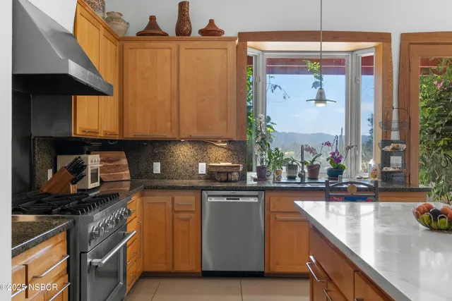 a bedroom with furniture and a staircase