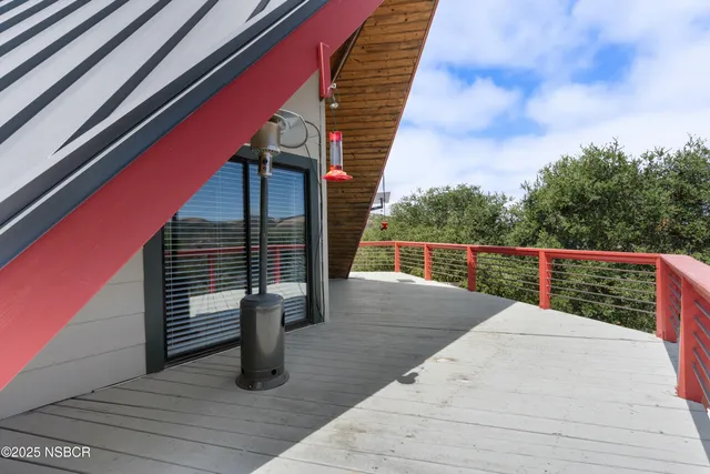 a kitchen that has a lot of cabinets a sink and appliances in it