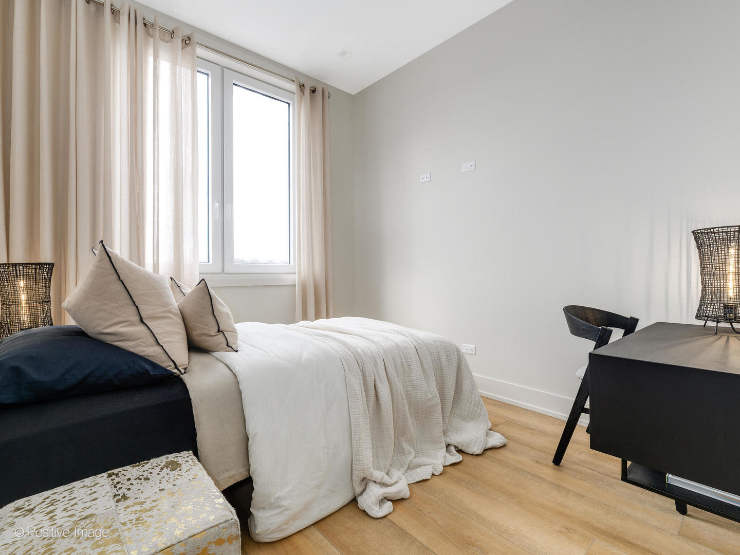 4232 West Belmont Avenue, Unit 6 Chicago, IL 60641 - Photo 18 of 24 a bedroom with a bed and a window