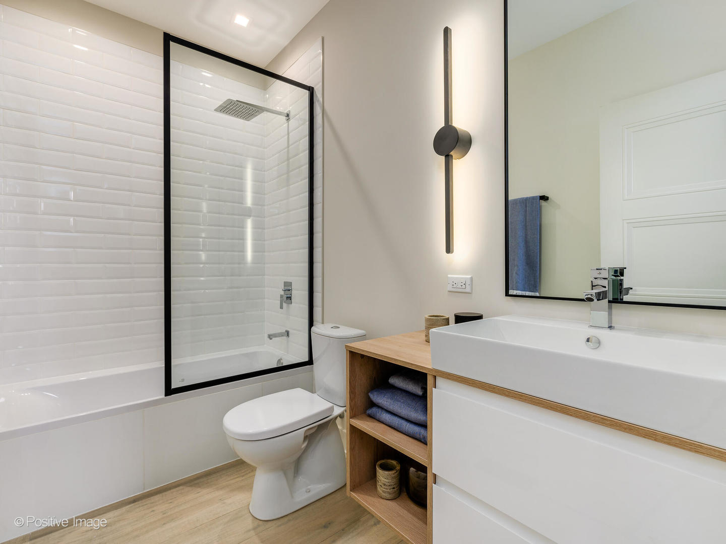 4232 West Belmont Avenue, Unit 6 Chicago, IL 60641 - Photo 19 of 24 a bathroom with a sink a toilet and shower