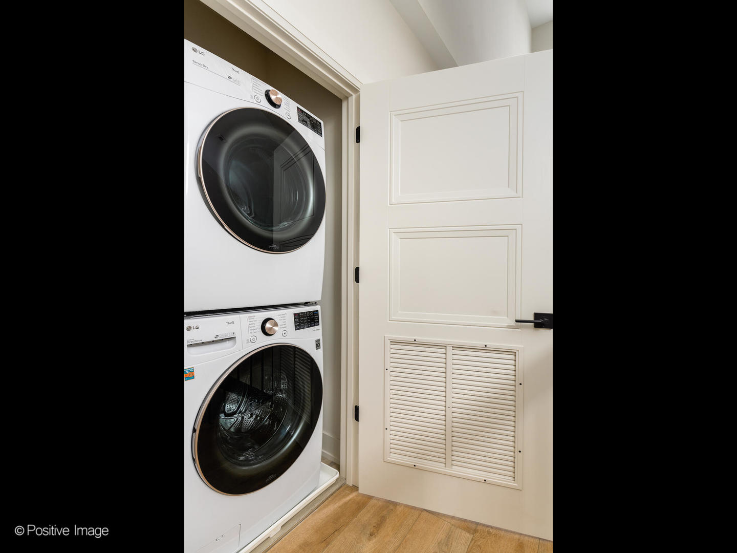 4232 West Belmont Avenue, Unit 6 Chicago, IL 60641 - Photo 20 of 24 a view of a hallway with washer and dryer