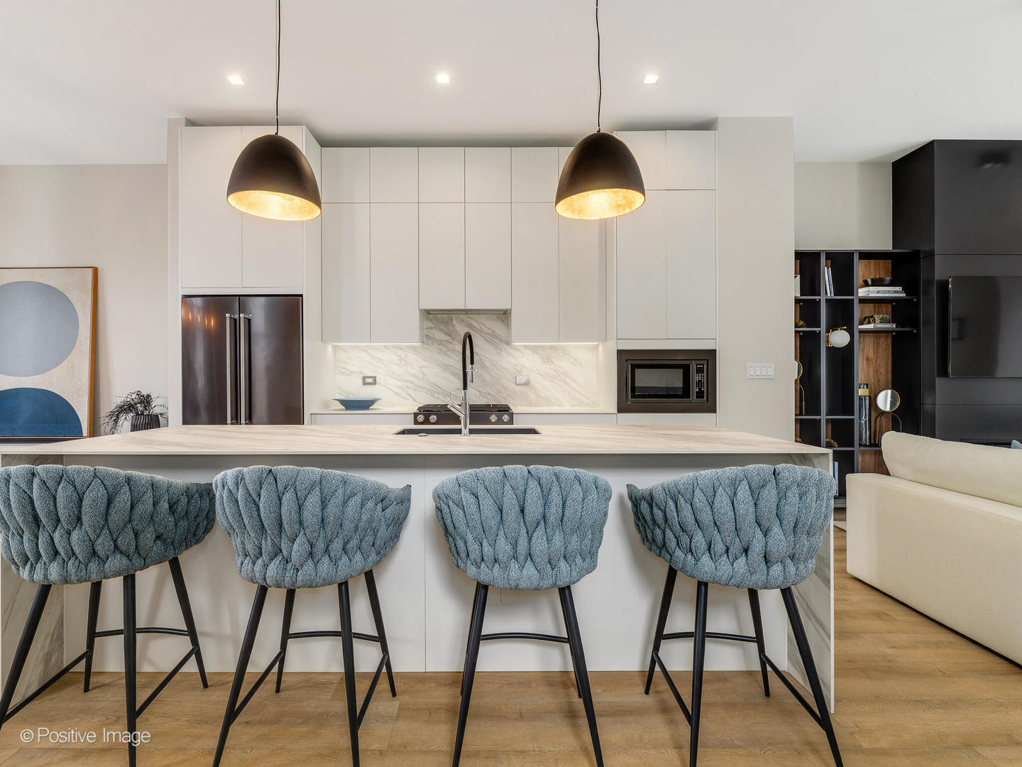 4232 West Belmont Avenue, Unit 6 Chicago, IL 60641 - Photo 3 of 24 a kitchen with stainless steel appliances granite countertop a dining table chairs sink and white cabinets