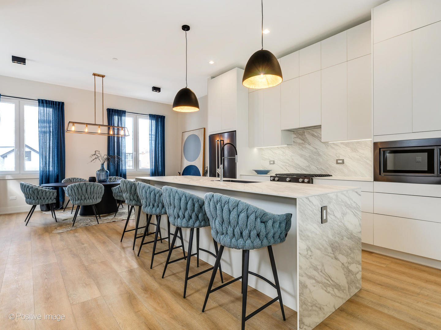 4232 West Belmont Avenue, Unit 6 Chicago, IL 60641 - Photo 4 of 24 a kitchen with stainless steel appliances granite countertop counter space a sink refrigerator and cabinets