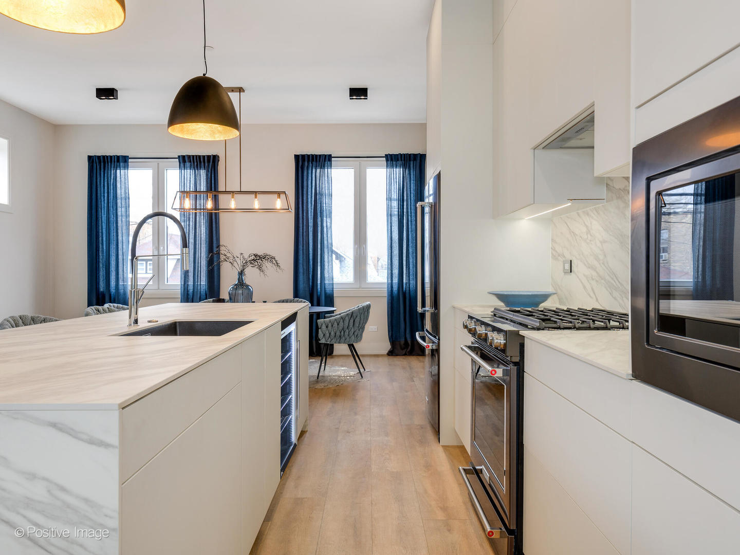 4232 West Belmont Avenue, Unit 6 Chicago, IL 60641 - Photo 6 of 24 a kitchen with stove a sink and a refrigerator