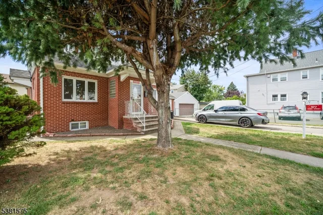 a house with car parked in front of it