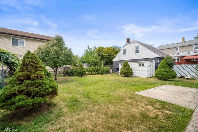 a house view with a backyard space