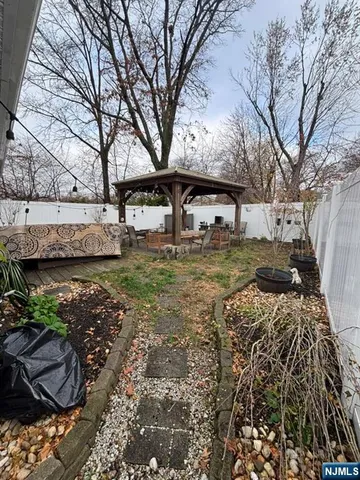 a view of a yard with large trees