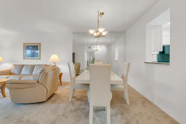 a bathroom with a granite countertop sink mirror toilet and shower