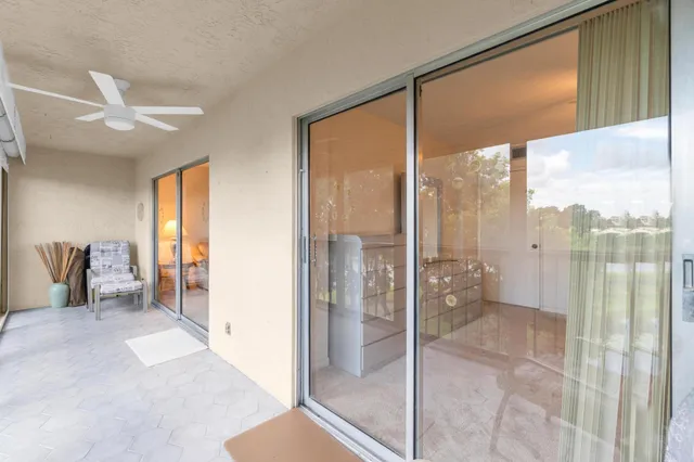 a view of a backyard with swimming pool