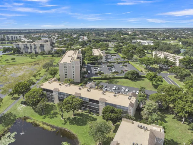 a group of people sitting at tables in a living room