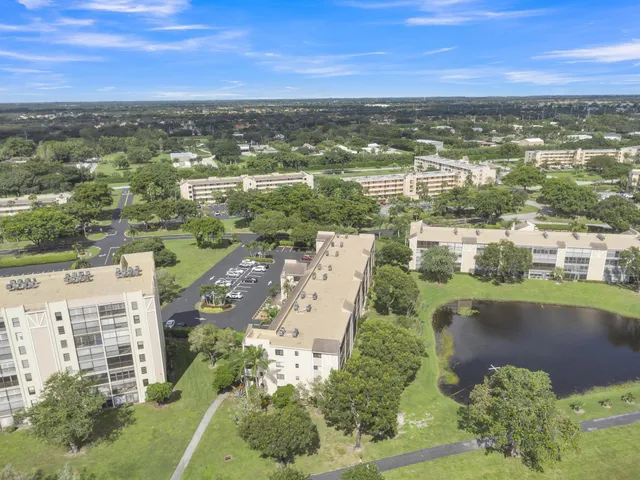 a view of a a dining room with furniture window and wooden floor