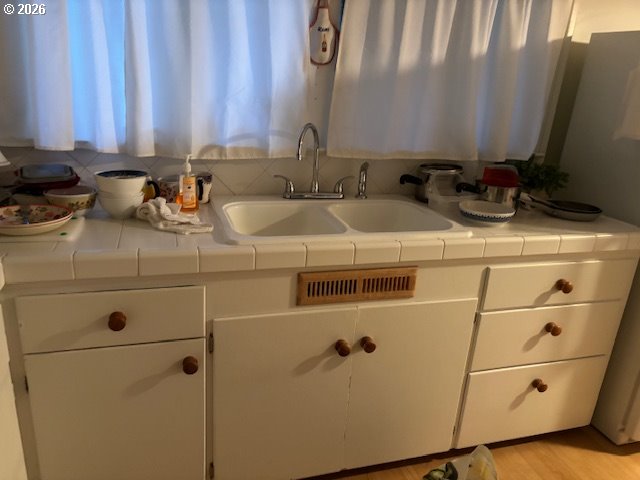 2027 North Webster Street Portland, OR 97217 - Photo 5 of 16 a bathroom with a sink and a mirror