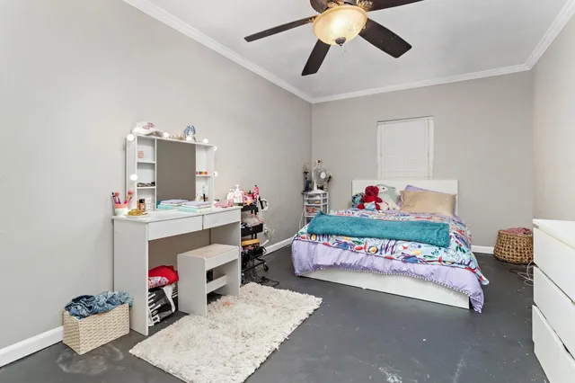 a bedroom with a bed and dresser