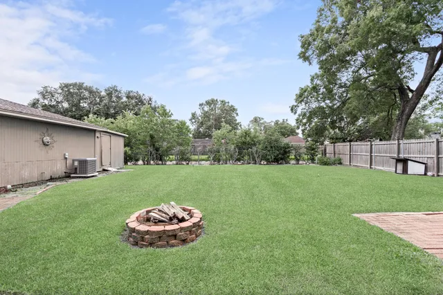 a backyard of a house with lots of green space