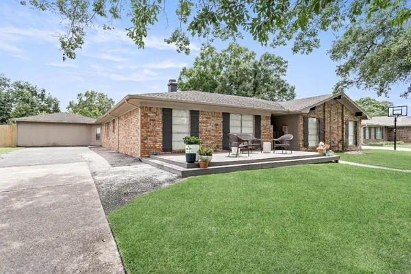 a front view of house with yard and seating area