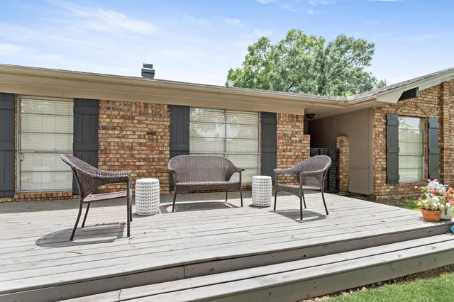 a patio with table and chairs