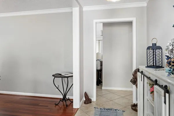 a view of an entryway with wooden floor