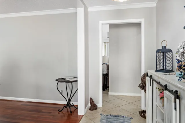 a view of an entryway with wooden floor