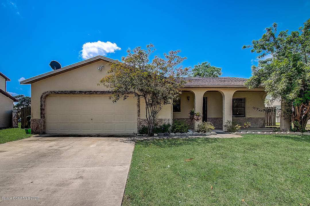 192 Cinnamon Bay Lane Melbourne, FL 32901 - Photo 1 of 34 a front view of a house with garden