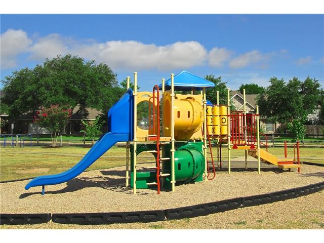 7006 Rambollet Terrace Round Rock, TX 78681 - Photo 34 of 38 A vibrant playground structure offers ample space for active recreation within a community green space.