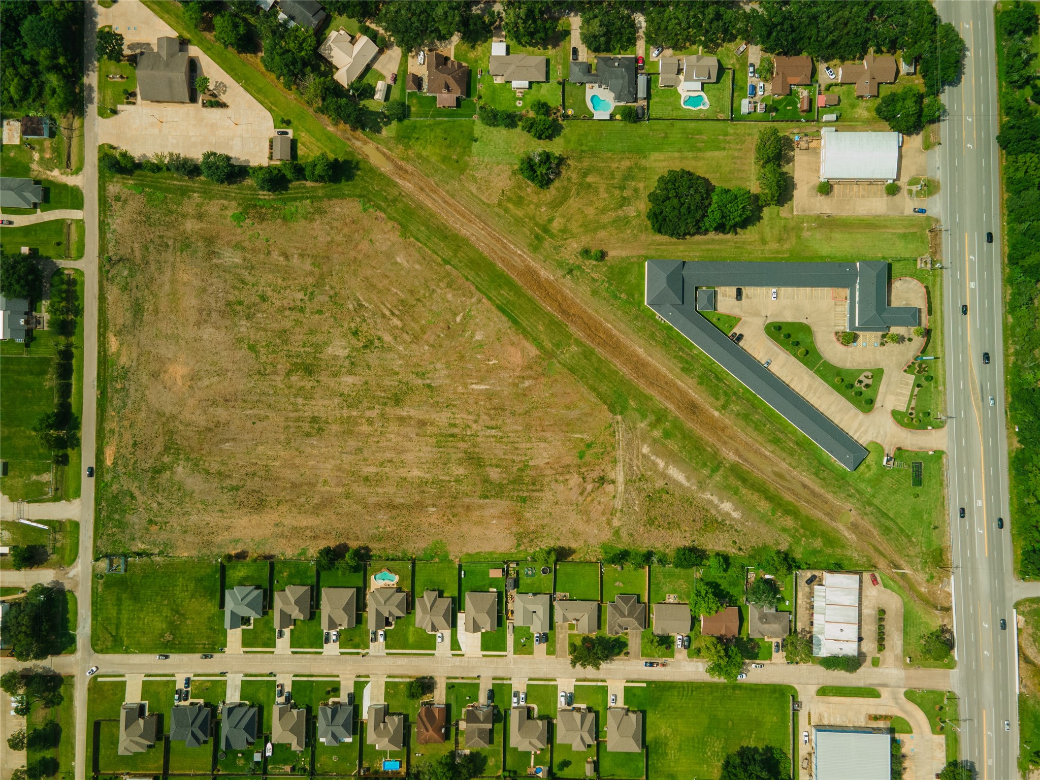 0 Karankawa Street Angleton, TX 77515 - Photo 21 of 22 a view of a swimming pool with a garden