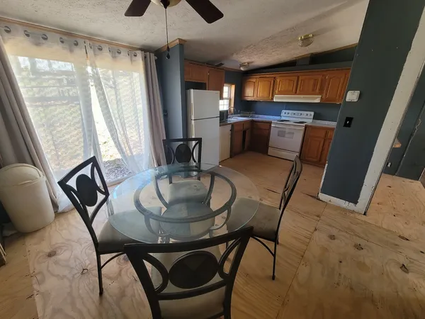 a view of a dining room with furniture window and outside view